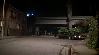 Movie still from “Made” (2001), directed by Jon Favreau – A car parked on the side of the road at night; Wide shot, High angle