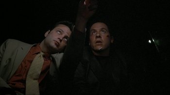 Movie still from “Made” (2001), directed by Jon Favreau – A couple of men standing next to each other; Close Up shot, Low angle