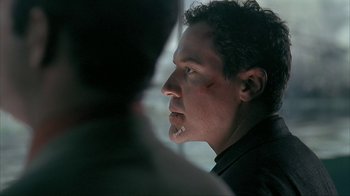 Movie still from “Made” (2001), directed by Jon Favreau – A person wearing a black shirt; Close Up shot, Over the shoulder angle