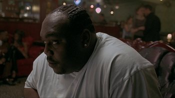 Movie still from “Made” (2001), directed by Jon Favreau – A person sitting in a room; Close Up shot, Low angle