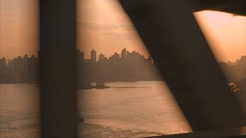 Movie still from “Made” (2001), directed by Jon Favreau – A view of a city from a boat on a river; Extreme Wide shot, Low angle