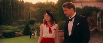 Movie still from “Magic in the Moonlight” (2014), directed by Woody Allen – A man and a woman standing next to each other; Medium shot, Over the shoulder angle