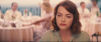 Movie still from “Magic in the Moonlight” (2014), directed by Woody Allen – A person wearing a shirt; Close Up shot, Over the shoulder angle