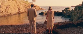 Movie still from “Magic in the Moonlight” (2014), directed by Woody Allen – A man and a woman standing on a beach; Wide shot, High angle