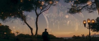 Movie still from “Magic in the Moonlight” (2014), directed by Woody Allen – A man standing next to a tree looking out over the ocean; Extreme Wide shot, Over the shoulder angle