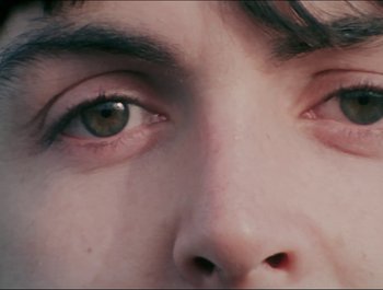 Movie still from “Magical Mystery Tour” (1967), directed by Ringo Starr – View of a person's eyes; Extreme Close Up shot, Overhead angle