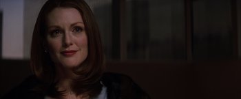 Movie still from “Magnolia” (1999), directed by Paul Thomas Anderson – A person sitting in front of a window; Close Up shot, Over the shoulder angle