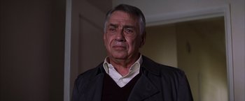 Movie still from “Magnolia” (1999), directed by Paul Thomas Anderson – An older man wearing a jacket and a white shirt; Close Up shot, Over the shoulder angle