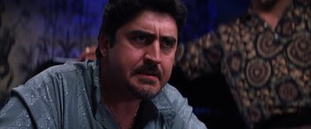 Movie still from “Magnolia” (1999), directed by Paul Thomas Anderson – A person with a beard; Close Up shot, Low angle