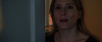 Movie still from “Magnolia” (1999), directed by Paul Thomas Anderson – A woman's face as she looks out a window; Close Up shot, Over the shoulder angle