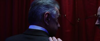 Movie still from “Magnolia” (1999), directed by Paul Thomas Anderson – A man's head and shoulders; Close Up shot, Over the shoulder angle