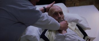 Movie still from “Magnolia” (1999), directed by Paul Thomas Anderson – An older man being assisted by a doctor; Close Up shot, High angle