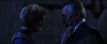 Movie still from “Magnolia” (1999), directed by Paul Thomas Anderson – An older man and a younger woman looking at each other; Close Up shot, Over the shoulder angle