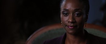 Movie still from “Magnolia” (1999), directed by Paul Thomas Anderson – A person sitting in a chair; Close Up shot, Over the shoulder angle