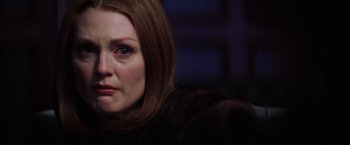 Movie still from “Magnolia” (1999), directed by Paul Thomas Anderson – A person with long hair; Close Up shot, Over the shoulder angle