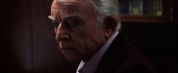 Movie still from “Magnolia” (1999), directed by Paul Thomas Anderson – An old man with a white beard looking at the camera; Close Up shot, Low angle
