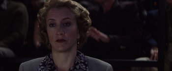 Movie still from “Magnolia” (1999), directed by Paul Thomas Anderson – A person wearing a suit and tie; Close Up shot, Over the shoulder angle