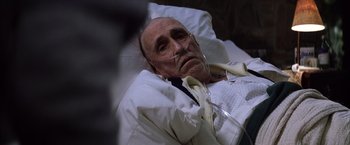 Movie still from “Magnolia” (1999), directed by Paul Thomas Anderson – An old man laying in a hospital bed; Close Up shot, High angle