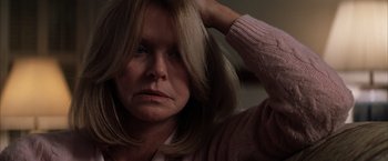 Movie still from “Magnolia” (1999), directed by Paul Thomas Anderson – A person holding their hair up; Close Up shot, Low angle