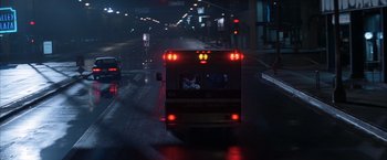 Movie still from “Magnolia” (1999), directed by Paul Thomas Anderson – A bus driving down a street at night; Extreme Wide shot, Low angle