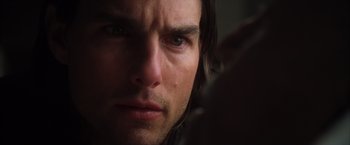 Movie still from “Magnolia” (1999), directed by Paul Thomas Anderson – A man's face looking at the camera; Close Up shot, Over the shoulder angle