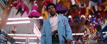 Movie still from “Magnum Force” (1973), directed by Ted Post – A man in a blue jacket holding a knife in his hand; Medium shot, Low angle