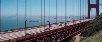 Movie still from “Magnum Force” (1973), directed by Ted Post – A view of the golden gate bridge from a distance; Extreme Wide shot, High angle