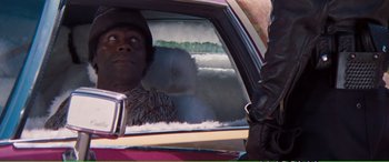 Movie still from “Magnum Force” (1973), directed by Ted Post – A woman sitting in the back seat of a car; Medium shot, Over the shoulder angle