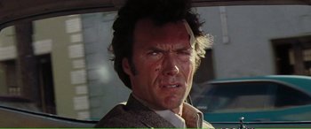 Movie still from “Magnum Force” (1973), directed by Ted Post – A man with a bandage on his face; Close Up shot, Over the shoulder angle