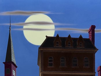 Movie still from “Make Mine Music” (1946), directed by Hamilton Luske – A full moon setting behind a building and a church steeple; Extreme Wide shot, Low angle