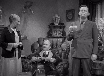 Movie still from “Make Way for Tomorrow” (1937), directed by Leo McCarey – An old photo of two men and an old woman; Medium shot, Low angle