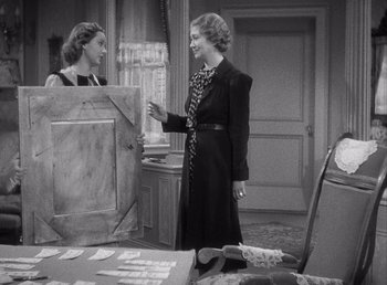 Movie still from “Make Way for Tomorrow” (1937), directed by Leo McCarey – Two women are talking in an old fashion photo; Medium shot, High angle