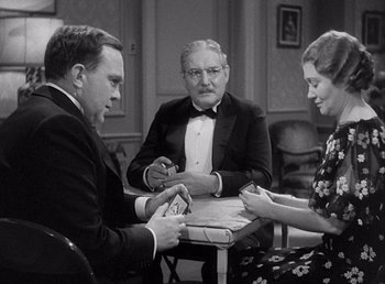 Movie still from “Make Way for Tomorrow” (1937), directed by Leo McCarey – A group of people sitting around a table; Medium shot, High angle