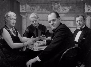 Movie still from “Make Way for Tomorrow” (1937), directed by Leo McCarey – A group of people sitting around a table; Medium shot, Low angle