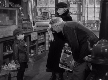 Movie still from “Make Way for Tomorrow” (1937), directed by Leo McCarey – An older man and a young boy looking at a woman; Medium shot, Over the shoulder angle