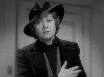 Movie still from “Make Way for Tomorrow” (1937), directed by Leo McCarey – An older woman wearing a hat and a suit; Close Up shot, High angle