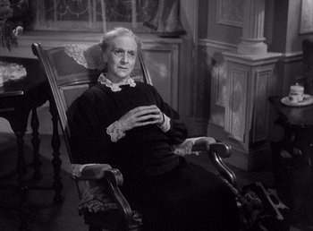 Movie still from “Make Way for Tomorrow” (1937), directed by Leo McCarey – An old woman sitting in a chair in a room; Medium shot, High angle