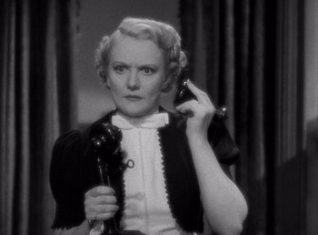 Movie still from “Make Way for Tomorrow” (1937), directed by Leo McCarey – An older woman is holding a phone up to her ear; Close Up shot, High angle