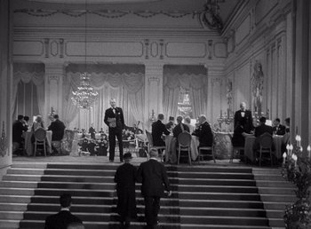 Movie still from “Make Way for Tomorrow” (1937), directed by Leo McCarey – A group of people sitting at tables in a room; Extreme Wide shot, High angle