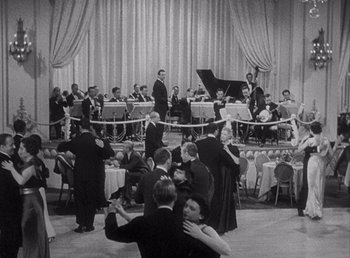 Movie still from “Make Way for Tomorrow” (1937), directed by Leo McCarey – An old photo of people dancing in front of an orchestra; Extreme Wide shot, High angle