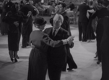 Movie still from “Make Way for Tomorrow” (1937), directed by Leo McCarey – An older man and a woman dancing in a ballroom; Medium shot, High angle