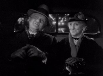 Movie still from “Make Way for Tomorrow” (1937), directed by Leo McCarey – A man and a woman sitting next to each other in a car; Close Up shot, High angle