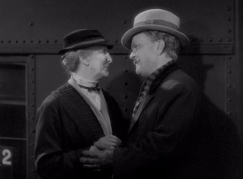 Movie still from “Make Way for Tomorrow” (1937), directed by Leo McCarey – A man and a woman standing next to each other; Medium shot, High angle