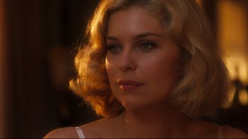 Movie still from “Malcolm X” (1992), directed by Spike Lee – A person with blonde curly hair; Close Up shot, Over the shoulder angle