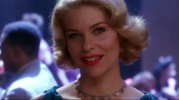 Movie still from “Malcolm X” (1992), directed by Spike Lee – A person wearing a necklace; Close Up shot, Over the shoulder angle