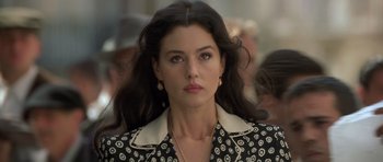 Movie still from “Malena” (2000), directed by Giuseppe Tornatore – A person with long hair; Close Up shot, Over the shoulder angle