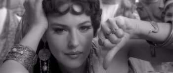 Movie still from “Malena” (2000), directed by Giuseppe Tornatore – A person holding a finger up; Close Up shot, High angle