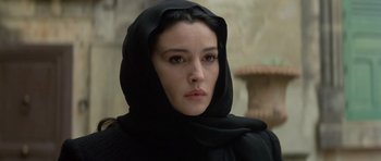 Movie still from “Malena” (2000), directed by Giuseppe Tornatore – A person wearing a head scarf; Close Up shot, Low angle