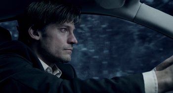 Movie still from “Mama” (2013), directed by Andy Muschietti – A person in a car; Close Up shot, Low angle