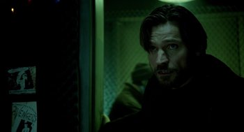 Movie still from “Mama” (2013), directed by Andy Muschietti – A person with a beard on a train; Close Up shot, Over the shoulder angle